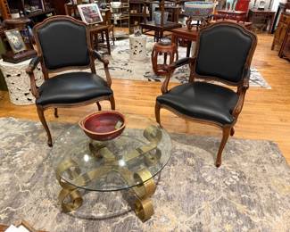 Leather armchairs, glass top coffee table