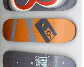 Pottery Barn Teen Skate Deck Wall Art — set of 3 decorative skateboard decks, each 31” wide x 8” high x 0.5” thick. Great for a teen room or game room.