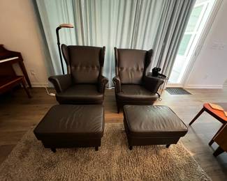 2 Brown Leather Strandmon Wing chairs with matching Ottomans