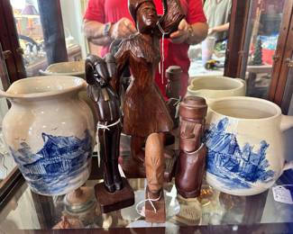 carved wood and blue and white pottery