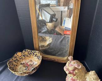 A Couple of Pieces Of Decor And A Mirror
