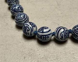 Blue and White Porcelain Shou Bead Necklace, Knotted on Blue Cord (3/4)