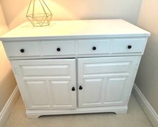 Chalk painted console cabinet. Good condition but left cabinet door does not stay closed properly. W - 36. D- 19. H- 30. Price - $ $46.00.
