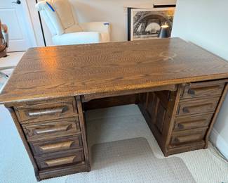 Antique Oak desk. 56 1/2 W 33 D 29 H. Desk top has water rings. Price - $40.00