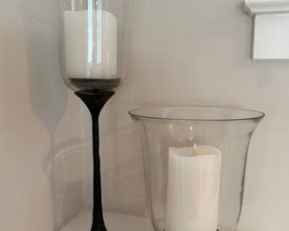 Two Pottery Barn Hurricanes. Tall - 20 1/2 H. 6D . Short - 11 H. 8 1/2 D. Price - $22.00