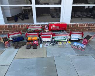LGB Model Railway train lot. Set includes 11 LGB straight tracks in box. 10 Piko straight tracks in box, 3 curved tracks, 3 short straight tracks, 2 catalogs, Parts new in package - 5026 isolating rail joiner, 5016 current feed clips, 1000/1 brass rail joiner. 9 trees. 1 lighted tree. 2 branch trees. 1 bottle liquid smoke. 4 light poles( 5035). 2051 S electronic Deutsche Bundesbahn. 1031 - Prellbock scale accessory. 10319 - Coal. 4003 - Vereins - Underwest bank Hamburg. 43610 - Worlds Greatest Dad golf ball car. 4040 S - Shell tank car. 4136 S- Circus car. 1985 - Jahreswagen 1985. 4059- LGB express car carrier,Car Carrier - car is missing wiper/side mirror/tire shows wear.Blue post office car - missing one door and top is loose. G scale. Price - $300.00
