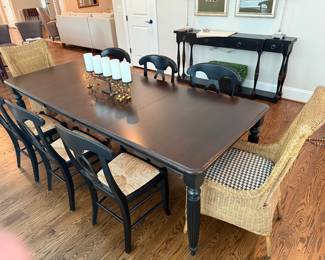 Thomasville black distressed dining table with 2 leaves, 2 wicker chairs. Price - $650.00s, and 6 Pottery Barn Chairs with rush bottoms. More photos available upon request. L- 96". W- 38". H- 30" Price - $620.00