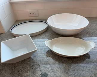 4 White serving dishes. 1 large bowl. 1 oval dish. 1 square Crate & Barrel bowl. 1 blue rimmed indigo Royal Copeland oval dish. Price - $16.00