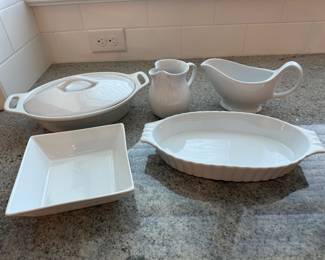 5 White serving pieces. 1 Bia gravy boat. 1 Chantal creamer. 1 Bia oval casserole. 1 square At Home dish. 1 lidded oval Palm casserole dish. Price - $16.00