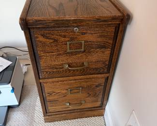 Antique Oak File cabinet. 16 W 25D 28 1/4 H. Side has a scrape. Message for more pictures. Price - $20.00
