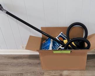 canister vacuum cleaner with hose, extension wand, and Mighty Mite-style replacement bags