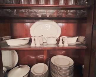 Lenox Solitaire: includes dinner and salad plates, platter, vegetable bowls, covered casserole, gravy boat, sugar and creamer, and salt and pepper shakers; Fostoria platinum-rimmed stemware