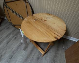 30-inch round wooden folding table with natural pine top