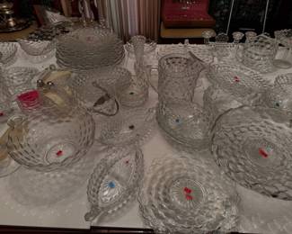 a massive collection of Fostoria Glass Company American Pattern (clear press-glass vintage clear cut glass and crystal dishware, including bowls, platters, pitchers, and serving dishes)