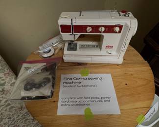 Elna Carina precision Swiss-made electronic sewing machine with original instruction manuals and extra accessories