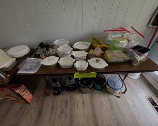 assortment of vintage Pyrex and CorningWare casserole dishes, covered baking dishes, glass storage sets, clear glass Pyrex bakeware, glass casserole dishes, and glass casserole lids