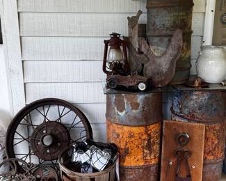 Metal wheels, metal oil drums, lantern, insulators