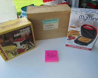 Lot 88: KitchenAid Food Grinder Attachment, Rotor Vegetable Slicer/Shredder Attachment, and Sandwich Maker