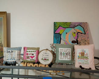 Lot 7: Assorted Handmade Decorative Pillows, Cross-Stitch Decor, and Wall Art
