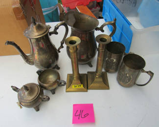 Lot 93: Silver-Tone Tea Service Pieces, Brass Candlesticks, and Metal Mugs
