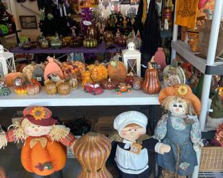 Decorative lanterns, scarecrows, pumpkins, pilgrims cornucopias