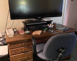 Desk, flatscreen, TV, and chair