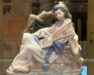 NAO Lladro Geisha (as is - tip of instrument is missing)