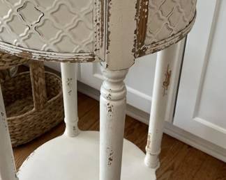 Round Distressed White Wooden Accent Table with Pressed Metal Apron Panel