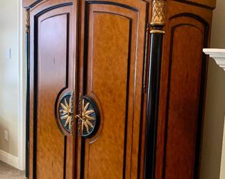 Biedermeier style armoire or wardrobe--features black ebonized columns, figured wood veneer and gilded mounts