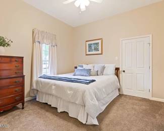 queen like new bed with wooden headboard