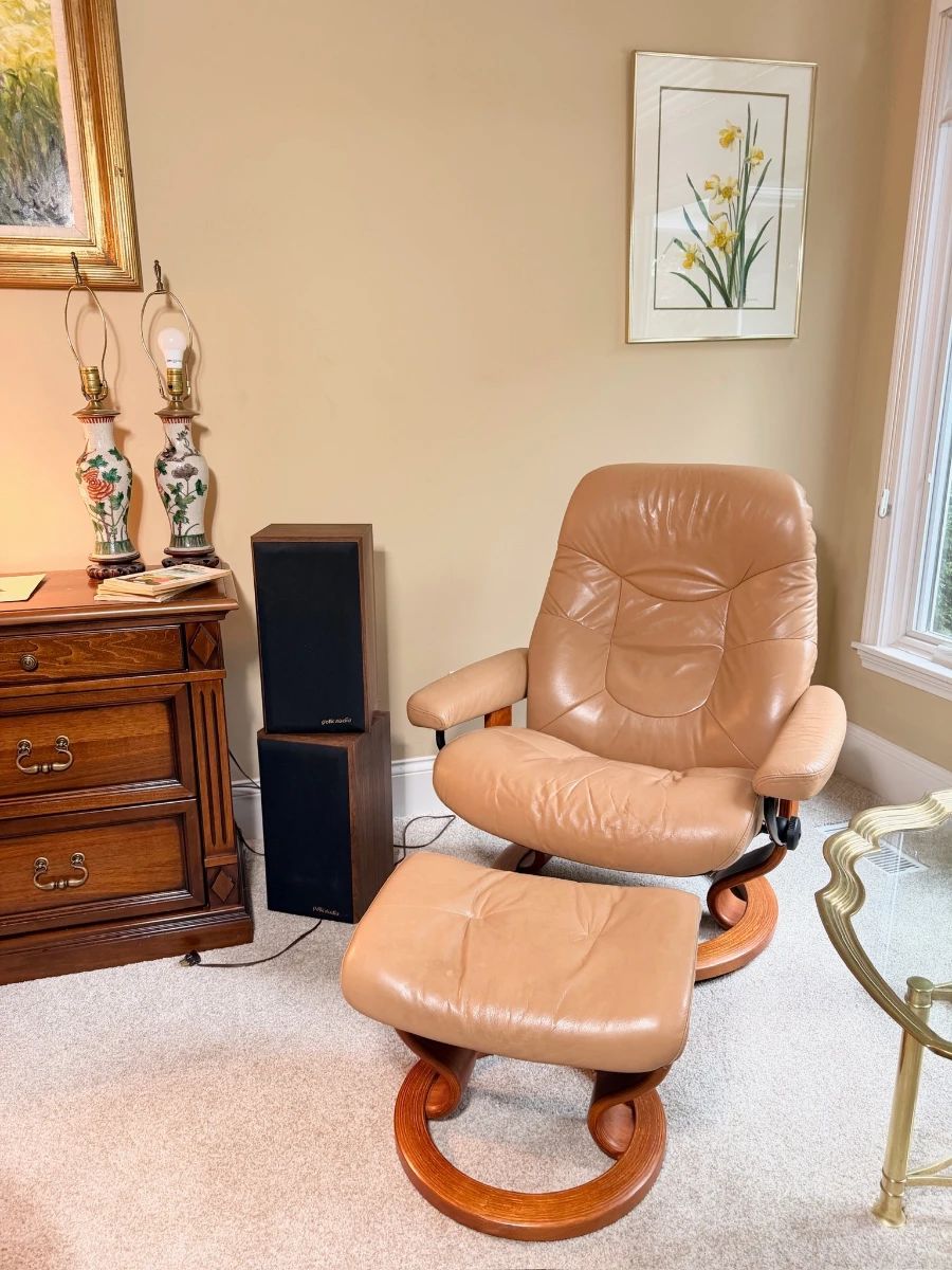 Ekornes Stressless tan leather swivel recliner with matching ottoman