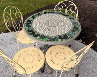 Mosaic garden table and four metal chairs