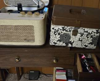 Record player and sewing machine on bottom of table