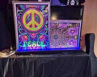 Posters with black light. New in package T-shirts size Large and XLarge.