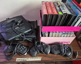 Sega Genesis set, missing power cord. Top box is only empty cases. Bottom box has cases with games. Will retake picture next week with titles visible.