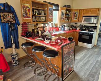 Here we have the spacious kitchen filled with bar stools...