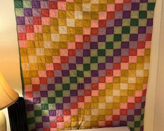 This is diagonal squares. This quilt was made before 1956 probably in the early 40s.
