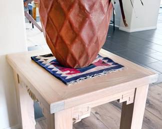 SW style table, woven textile, potted plant