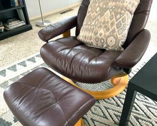 Leather armchairs with ottomen