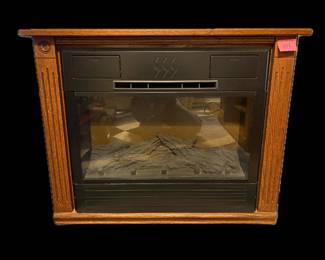 Heat Surge electric fireplace, movable heater on wheels, turns on. 