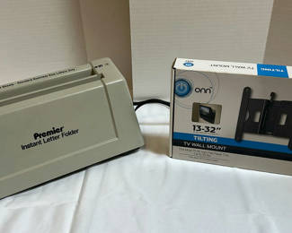 Lot 215: Premier Instant Letter Folder and Onn Tilting TV Wall Mount
