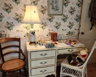 Antique wicker chair and a French provincial desk