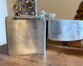 a giant tabletop Zippo style lighter, it works