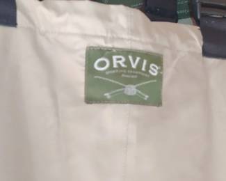 Orvis chest fishing waders featuring black adjustable suspenders and a prominent green with neoprene boots