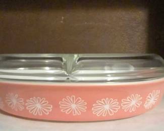vintage Pyrex Pink Daisy 1 1/2 Quart Divided Casserole Dish with a clear glass divided lid, produced by Corning Glass Works between 1956 and 1962