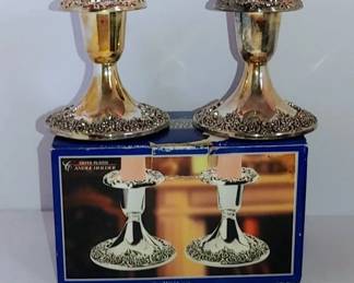 Beautiful pair of Sterling plated silver holder from the 1980s fresh out of the box and plastic never used but are tarnished