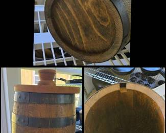 wooden barrel/ keg with dark metal bands and a matching lid with a knob handle, resembling a traditional small storage or biscuit barrel not the original top however it is notched to fit