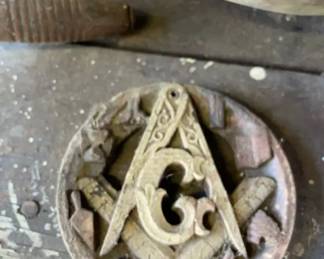 Masonic Wall Plaque A round wooden Masonic decorative plaque intricately carved with the central square and compass framing the letter G, surrounded by various working tools along the outer border.