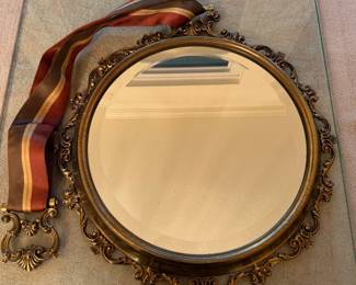 Unique brass mirror with ribbon holder