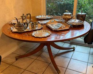 Inlaid wood dining table with clawfoot pedestal
